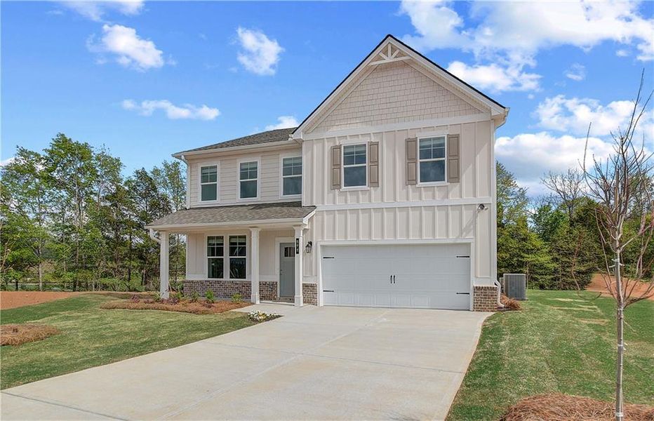 Front exterior of a new home in Cooper Park, McDonough, GA, highlighting curb appeal (Image 17).