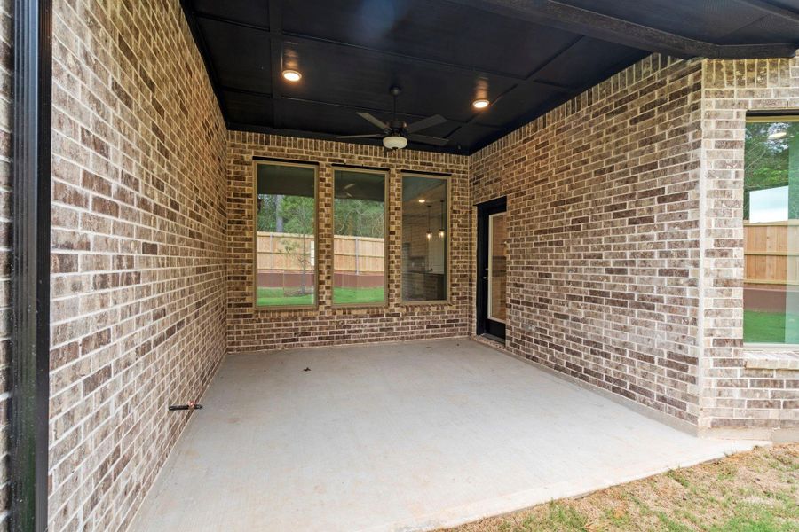 Exterior details and patio area of a home in Wildtree, Magnolia (Image 3).