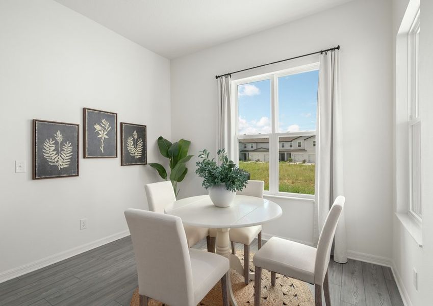 The dining room is open to the kitchen and family room.