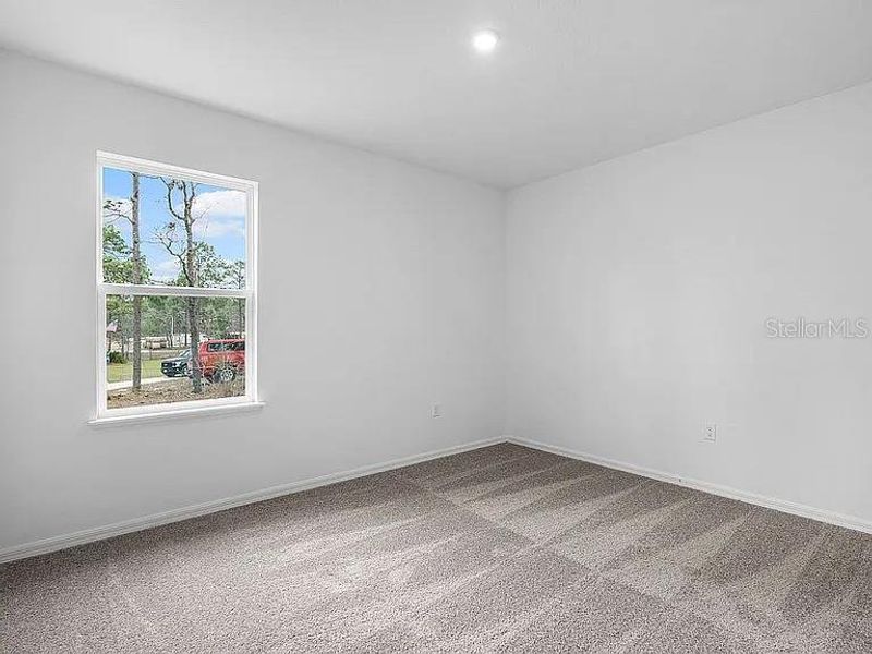 Spacious, unfurnished interior of a new home in Royal Highlands, Brooksville (Image 32).