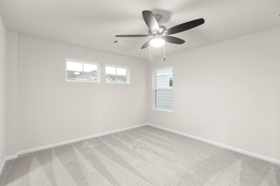 This room features light-colored walls and grey carpet flooring