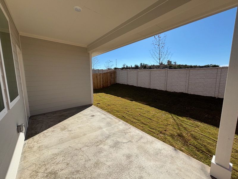 Exterior details and patio area of a home in Cannon Ranch 40s, Dripping Springs (Image 21).