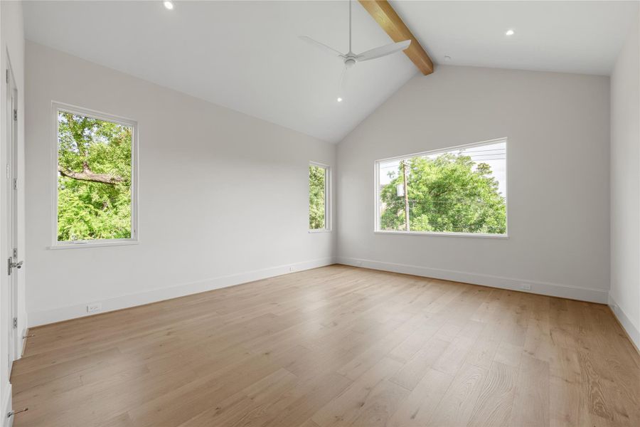 Upstairs, the large primary offers vaulted ceilings and tree views!