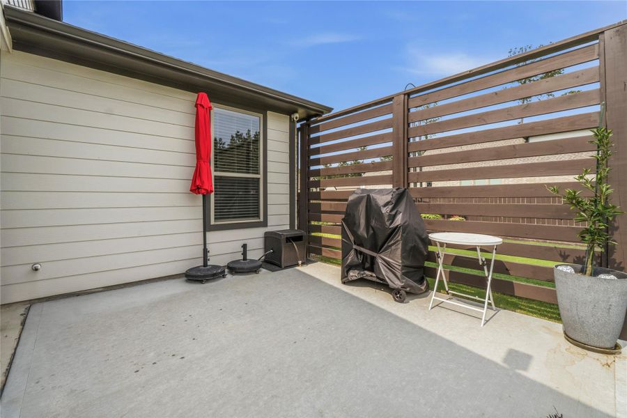 Exterior details and patio area of a home in Deer Pines, Conroe (Image 23).