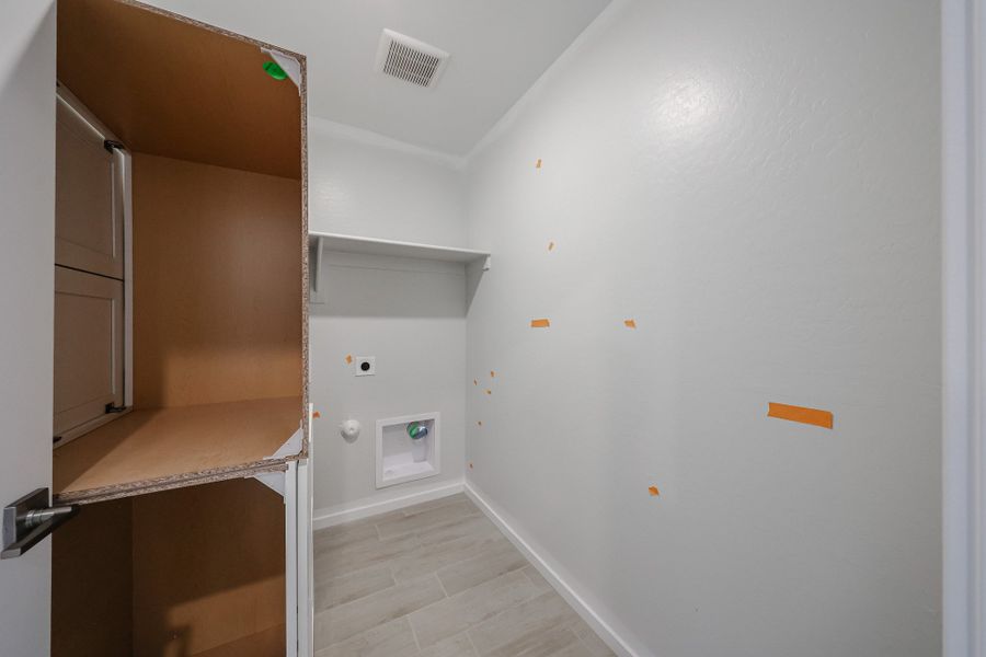 A room with a white wall and a wood floor. A room with a white wall and a wood floor.