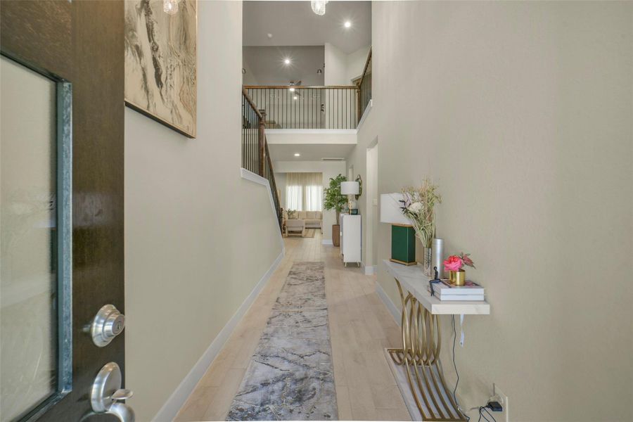 Welcoming foyer with soaring ceilings and elegant design.