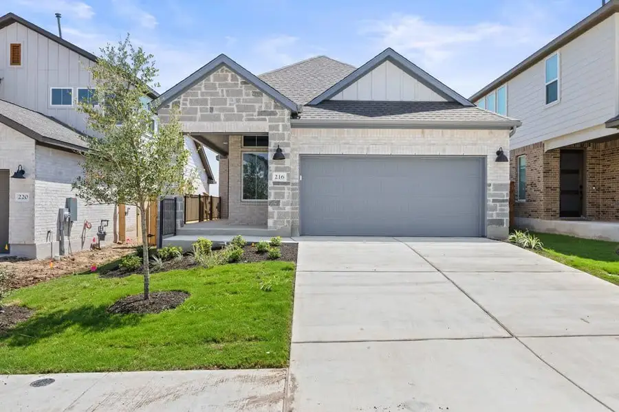 Front exterior of a new home in Lariat, Liberty Hill, TX, highlighting curb appeal (Image 1). Front exterior of a new home in Lariat, Liberty Hill, TX, highlighting curb appeal (Image 1).