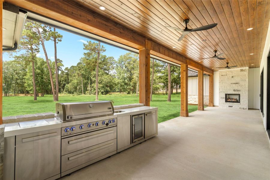 Mont Alpi Deluxe outdoor BBQ kitchen with 6 burner grill, sink, beverage fridge, and granite countertop. Mont Alpi Deluxe outdoor BBQ kitchen with 6 burner grill, sink, beverage fridge, and granite countertop.