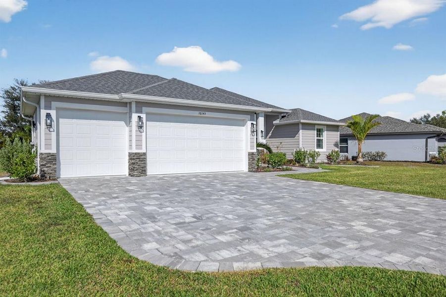 Front exterior of a new home in , Punta Gorda, FL, highlighting curb appeal (Image 22).