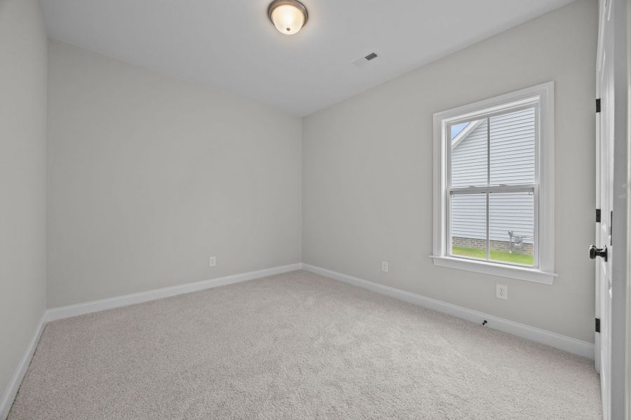 Spacious, unfurnished interior of a new home in The Preserve at Langston, Winterville (Image 47).