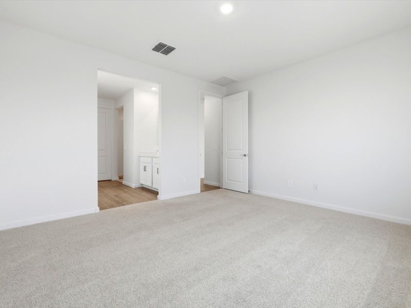 Spacious, unfurnished interior of a new home in Blossom Rock Reserve Series, Apache Junction (Image 13).