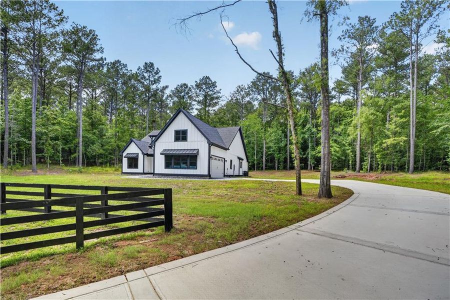 Front exterior of a new home in , Buckhead, GA, highlighting curb appeal (Image 28). Front exterior of a new home in , Buckhead, GA, highlighting curb appeal (Image 28).
