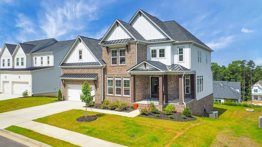 Front exterior of a new home in , Woodstock, GA, highlighting curb appeal (Image 29).