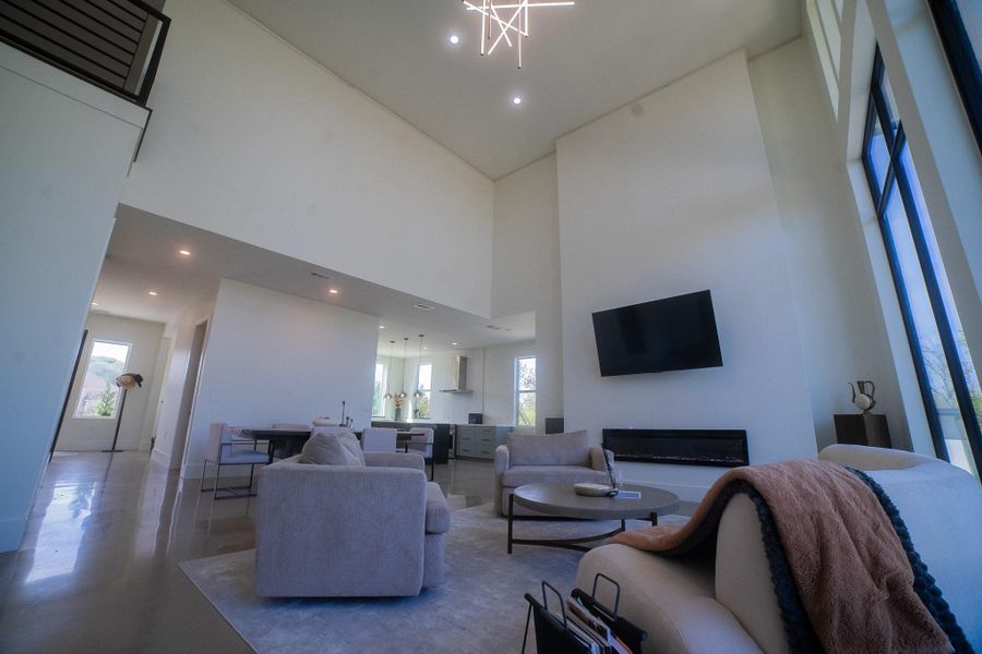 Another view of the open floor flowing from the living room all the way to the kitchen and the entance