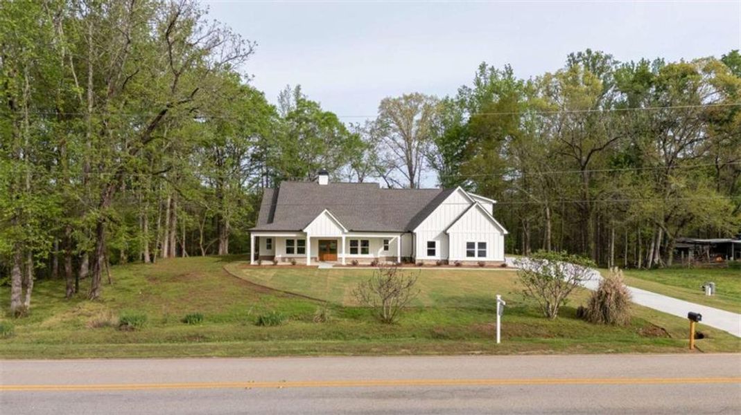 Front exterior of a new home in , Covington, GA, highlighting curb appeal (Image 24).