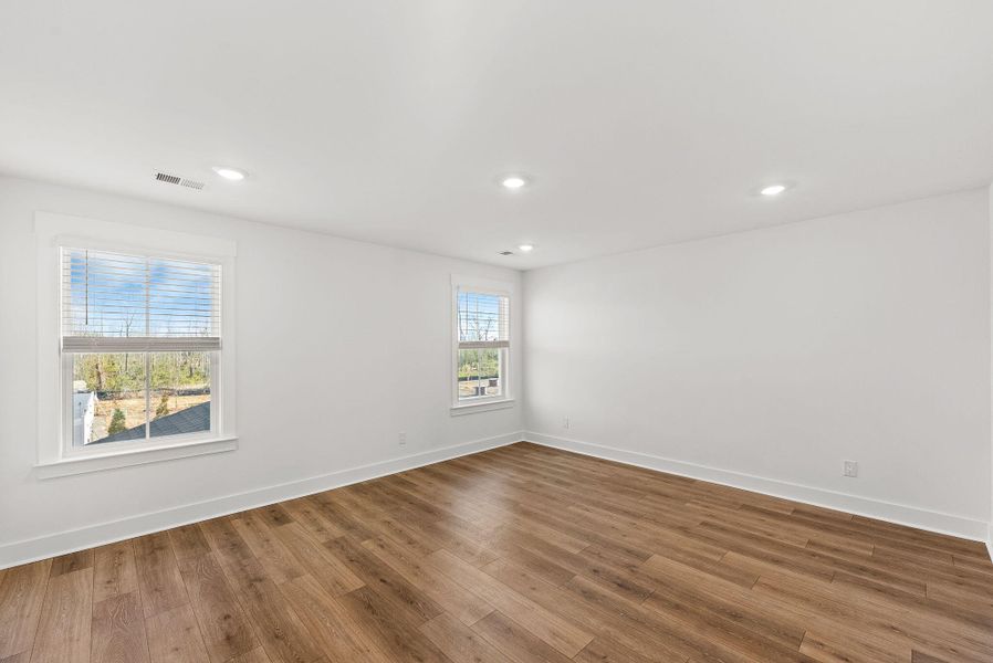 Spacious, unfurnished interior of a new home in The Coves at Lakes of Cane Bay, Summerville (Image 26). Spacious, unfurnished interior of a new home in The Coves at Lakes of Cane Bay, Summerville (Image 26).