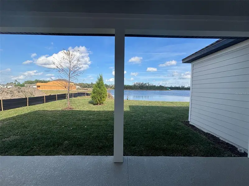 Exterior details and patio area of a home in Ardisia Park Estate, New Smyrna Beach (Image 3).