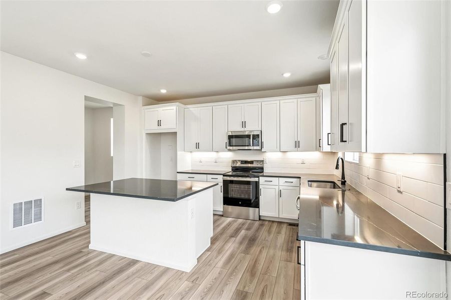 Furnished interior view inside a new home in Windsong, Thornton (Image 6).