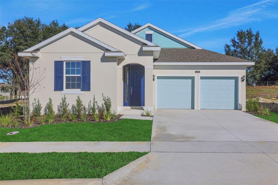 Front exterior of a new home in Crossroads at Kelly Park, Apopka, FL, highlighting curb appeal (Image 22). Front exterior of a new home in Crossroads at Kelly Park, Apopka, FL, highlighting curb appeal (Image 22).