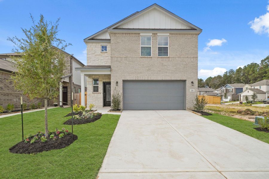 Front exterior of a new home in Lakes at Black Oak, Magnolia, TX, highlighting curb appeal (Image 2).