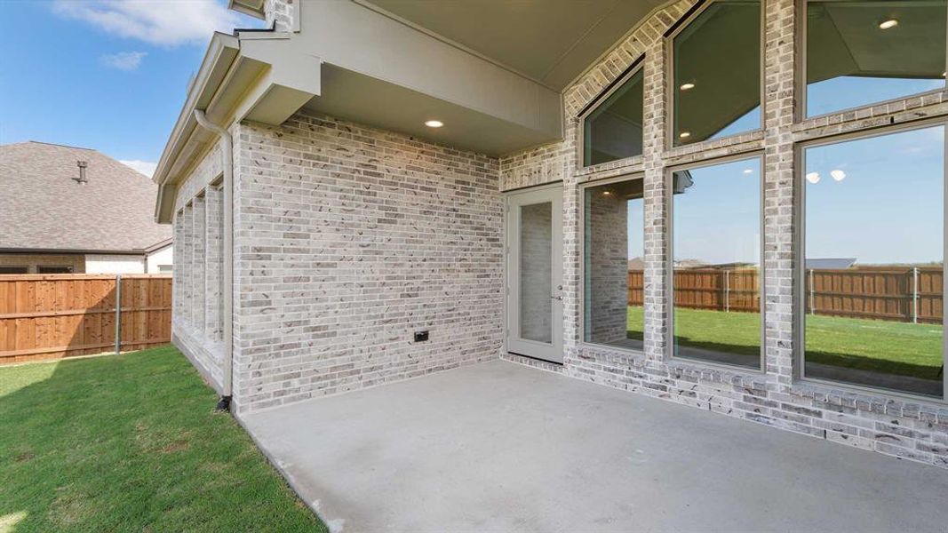 Exterior details and patio area of a home in Terraces 62', Rockwall (Image 3). Exterior details and patio area of a home in Terraces 62', Rockwall (Image 3).