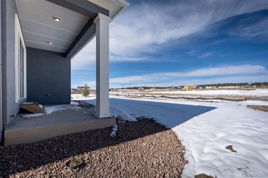Exterior details and patio area of a home in Wolf Ranch - Enclave Collection, Colorado Springs (Image 3).