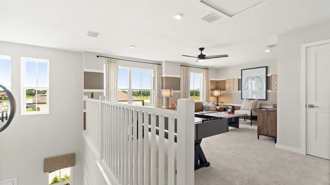 Second Floor Loft Space staged as a game room in this New Construction Home in Winter Haven by DRB Homes in Willowbrook North Second Floor Loft Space staged as a game room in this New Construction Home in Winter Haven by DRB Homes in Willowbrook North