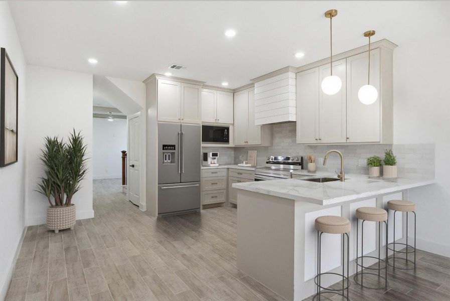 The kitchen offers a walk-in pantry, quartz countertops, stainless steel appliances—including a stove and dishwasher—and a convenient nook for your microwave.