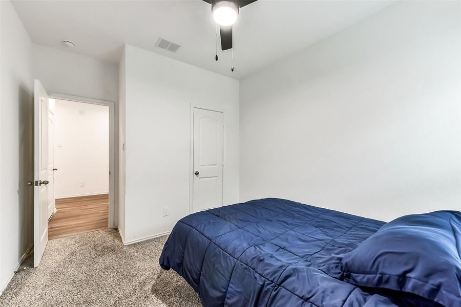 Furnished interior view inside a new home in Sunterra, Katy (Image 30).