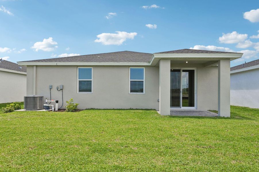 Front exterior of a new home in Hampton Park - Classic Series, Vero Beach, FL, highlighting curb appeal (Image 21). Front exterior of a new home in Hampton Park - Classic Series, Vero Beach, FL, highlighting curb appeal (Image 21).