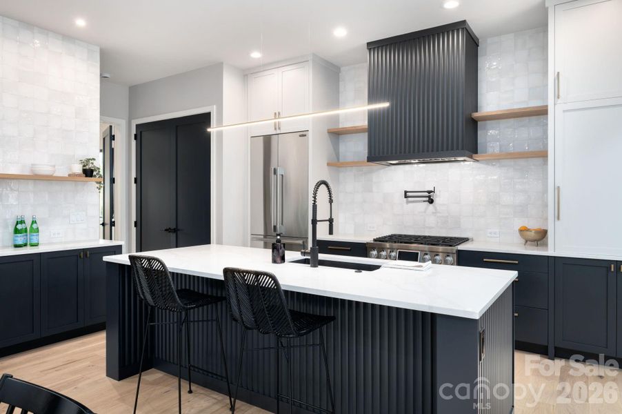 Spectacular Chef's Kitchen with Oversized Island, Quartz Counters and Luxury Appliances