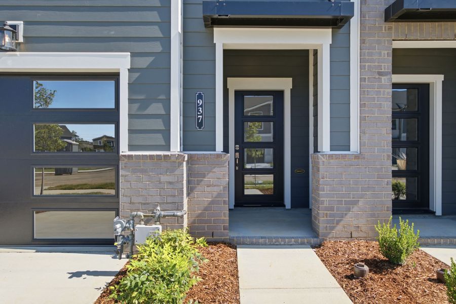 Exterior details and patio area of a home in Nexus Townhomes, Gallatin (Image 25).