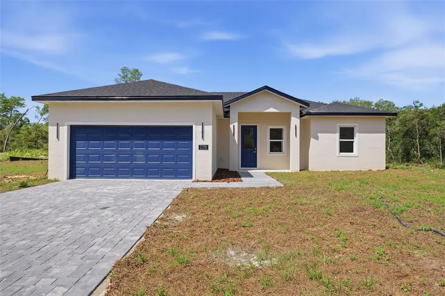 Front exterior of a new home in , Ocala, FL, highlighting curb appeal (Image 2). Front exterior of a new home in , Ocala, FL, highlighting curb appeal (Image 2).