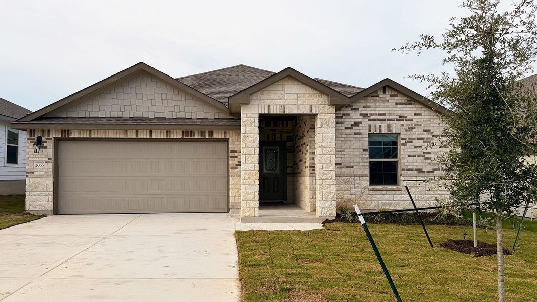 Front exterior of a new home in Warrior's Legacy, Nolanville, TX, highlighting curb appeal (Image 1). Front exterior of a new home in Warrior's Legacy, Nolanville, TX, highlighting curb appeal (Image 1).