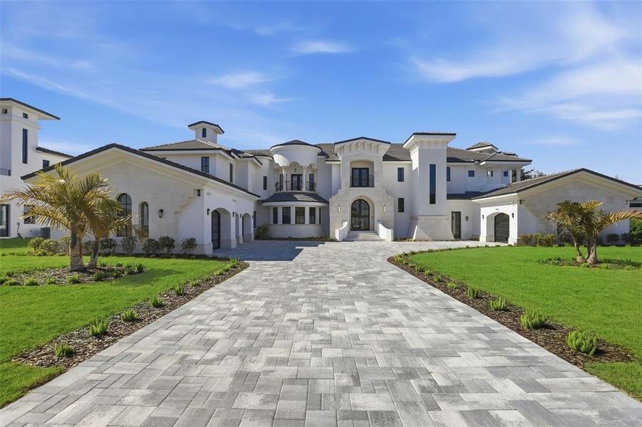 Front exterior of a new home in , Windermere, FL, highlighting curb appeal (Image 26). Front exterior of a new home in , Windermere, FL, highlighting curb appeal (Image 26).