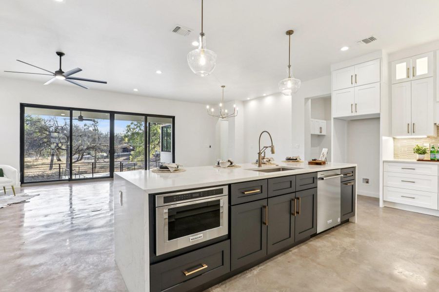 The kitchen flows seamlessly into the living and dining areas for easy entertaining.