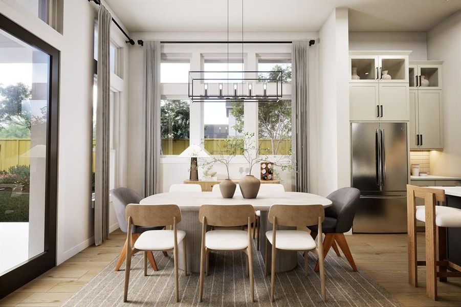 Dining room featuring light wood-style floors Dining room featuring light wood-style floors