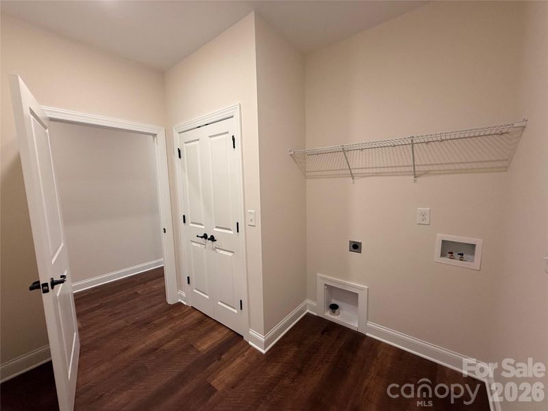 ...as well as shelving above the washer/dryer connections.