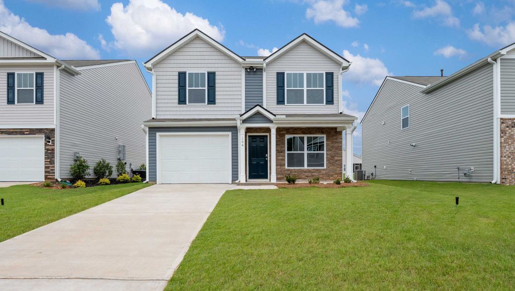 Front exterior of a new home in Harper Ridge, Roebuck, SC, highlighting curb appeal (Image 1).