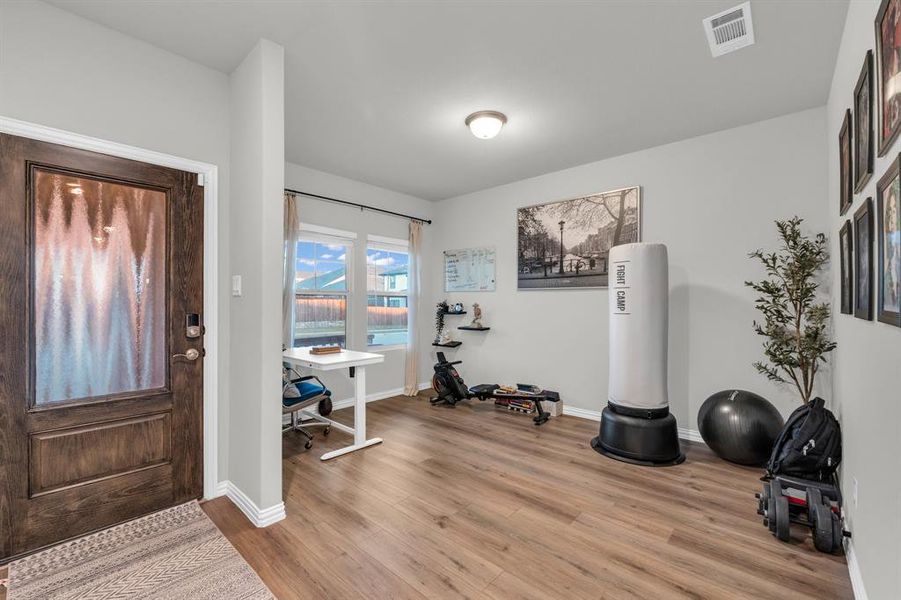 Foyer entrance with light wood-type flooring