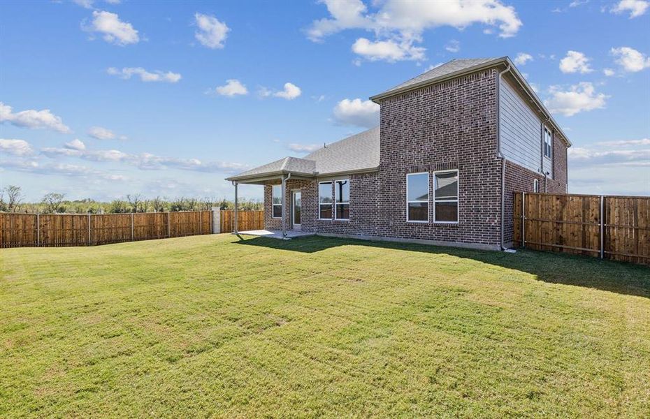 Covered patio offers ample space for entertaining or relaxing Covered patio offers ample space for entertaining or relaxing