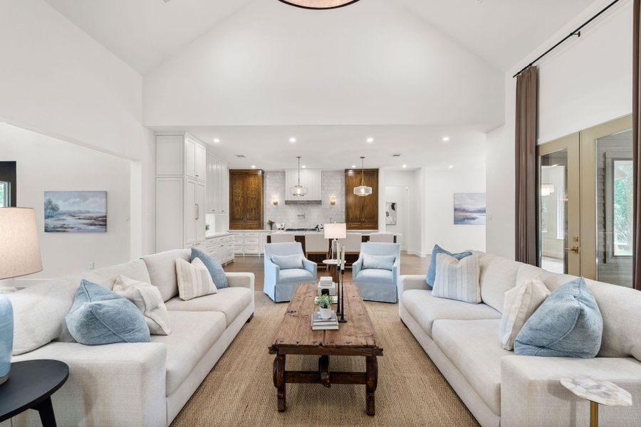 Wide-plank wood flooring and clean architectural lines give the space a bright, elevated feel while maintaining warmth and scale. Designed to make a statement the moment you walk in.