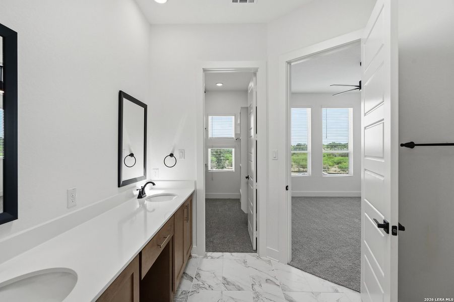 Furnished interior view inside a new home in Centero at Stone Oak, San Antonio (Image 16).