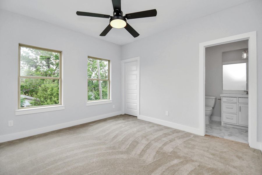One of two secondary bedrooms upstairs, this one is 12'9"x11'4" and is bathed in natural light! It offers a spacious walk-in closet and direct access to the beautiful secondary full bathroom! One of two secondary bedrooms upstairs, this one is 12'9"x11'4" and is bathed in natural light! It offers a spacious walk-in closet and direct access to the beautiful secondary full bathroom!