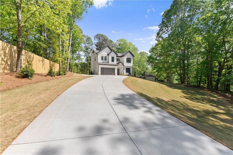 Front exterior of a new home in , Flowery Branch, GA, highlighting curb appeal (Image 22).