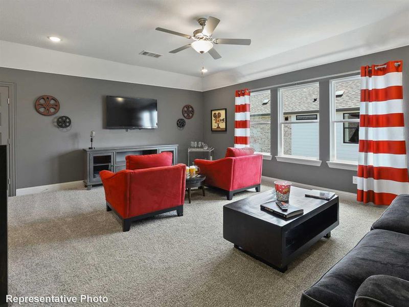 Living room with carpet flooring, a ceiling fan, and recessed lighting Living room with carpet flooring, a ceiling fan, and recessed lighting