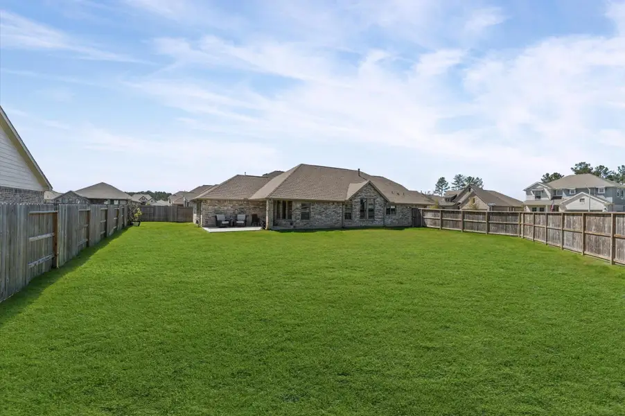 Exterior details and patio area of a home in The Trails, New Caney (Image 3). Exterior details and patio area of a home in The Trails, New Caney (Image 3).