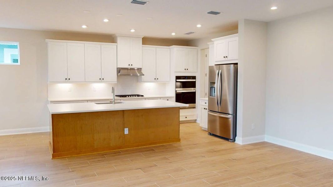 Furnished interior view inside a new home in RiverTown - WaterSong, St. Johns (Image 4).