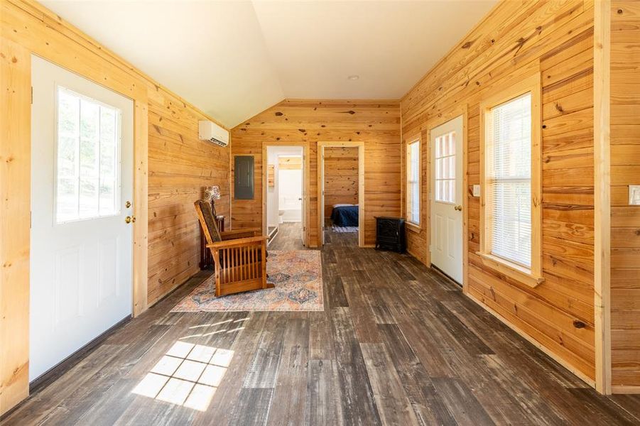 Interior space featuring wood-finish flooring and extensive wood paneling
