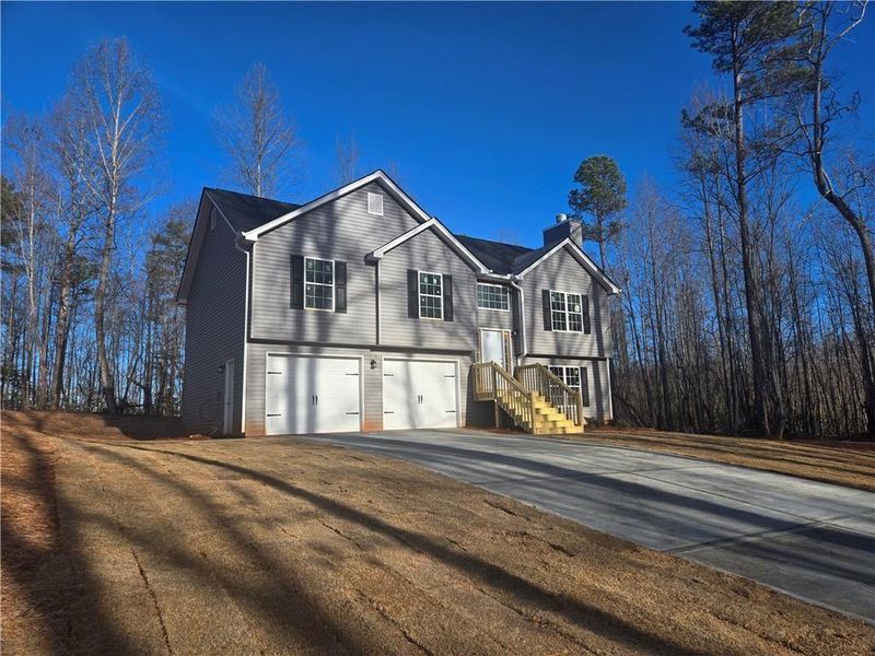 Front exterior of a new home in , Demorest, GA, highlighting curb appeal (Image 12).
